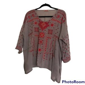 Johnny was blouse grey  with red embroidery